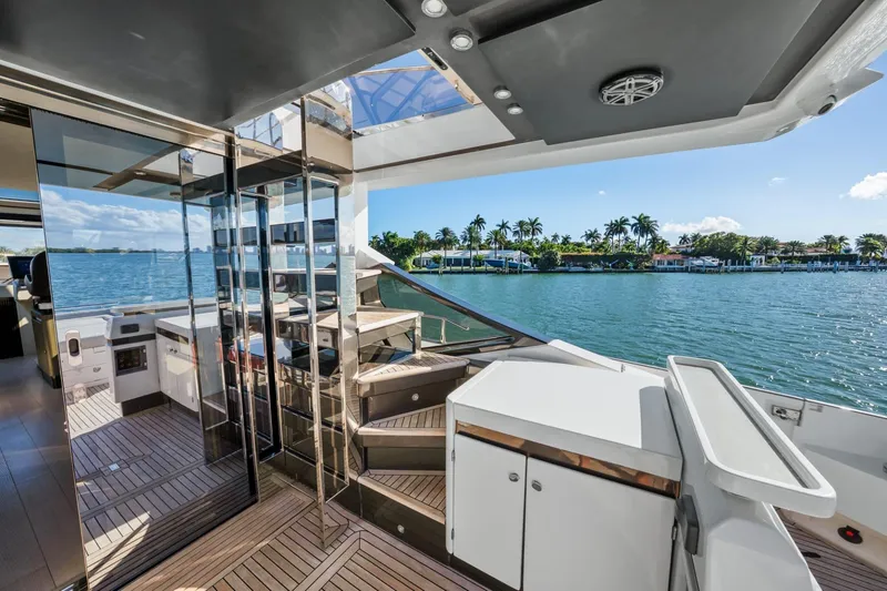 Slide: The Image of Luxurious 2019 Azimut S7 yacht deck with modern design and scenic waterfront view. - 13