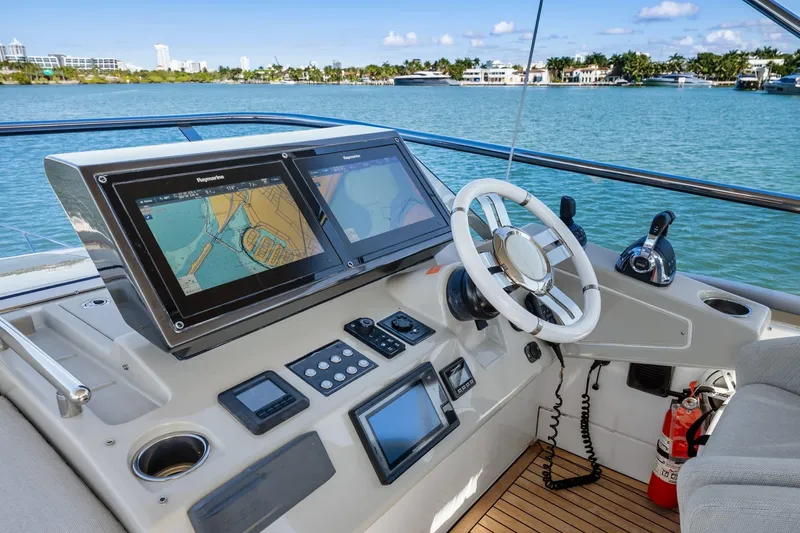 Slide: The Image of Cockpit of 2019 Azimut S7 yacht with navigation screens and steering wheel. - 17