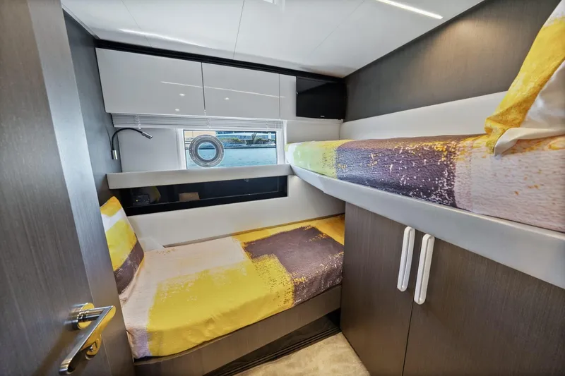 Slide: The Image of 2019 Azimut S7 yacht cabin with bunk beds and modern interior design. - 33