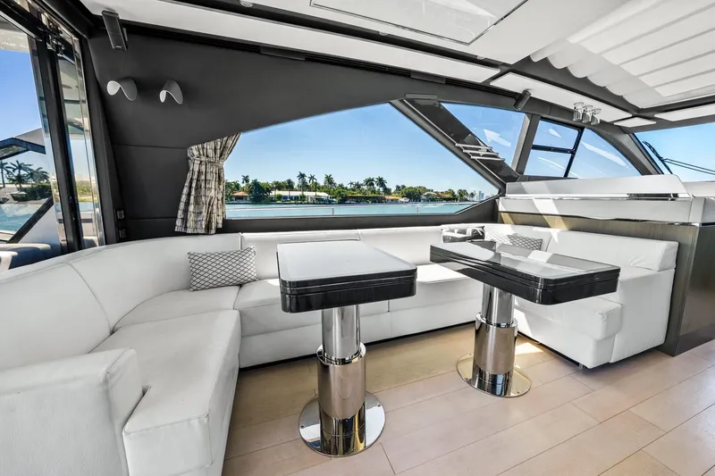 Slide: The Image of Luxurious interior of 2019 Azimut S7 yacht with elegant seating and scenic window view. - 44