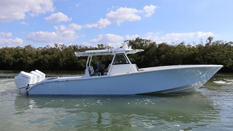 Slide: The Image of 2025 Yellowfin 39 Offshore boat cruising on calm water under a clear sky. - 10