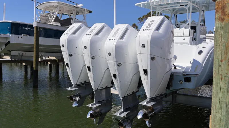 Slide: The Image of 2025 Yellowfin 39 Offshore boat with four powerful outboard engines docked in marina. - 13