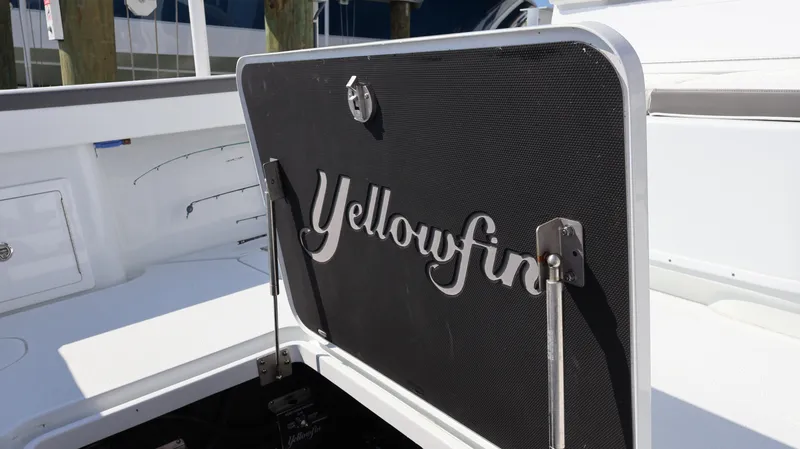 Slide: The Image of 2025 Yellowfin 39 Offshore boat hatch with logo, open on deck. - 23