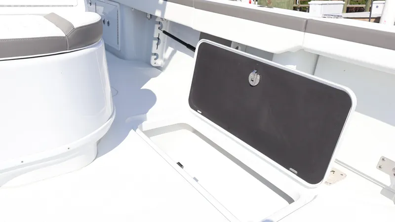 Slide: The Image of 2025 Yellowfin 39 Offshore boat deck with open storage compartment. - 28