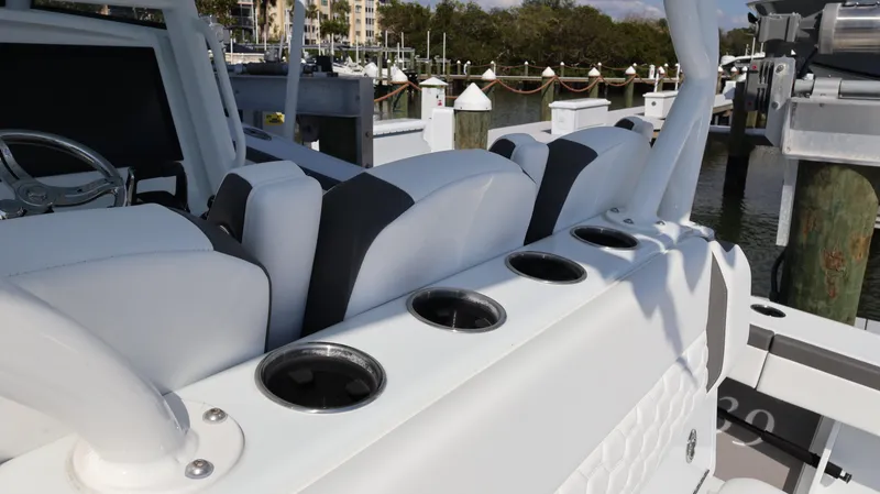 Slide: The Image of 2025 Yellowfin 39 Offshore boat interior with white seating and cup holders. - 33