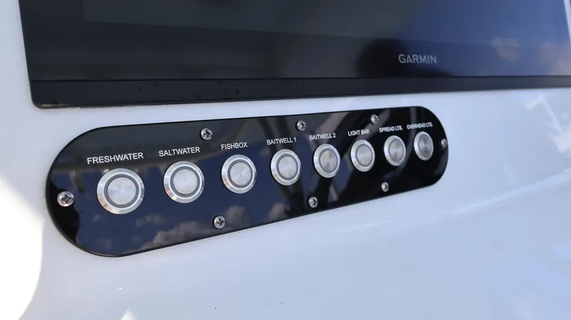 Slide: The Image of Control panel on 2025 Yellowfin 39 Offshore boat with labeled buttons for various functions. - 45