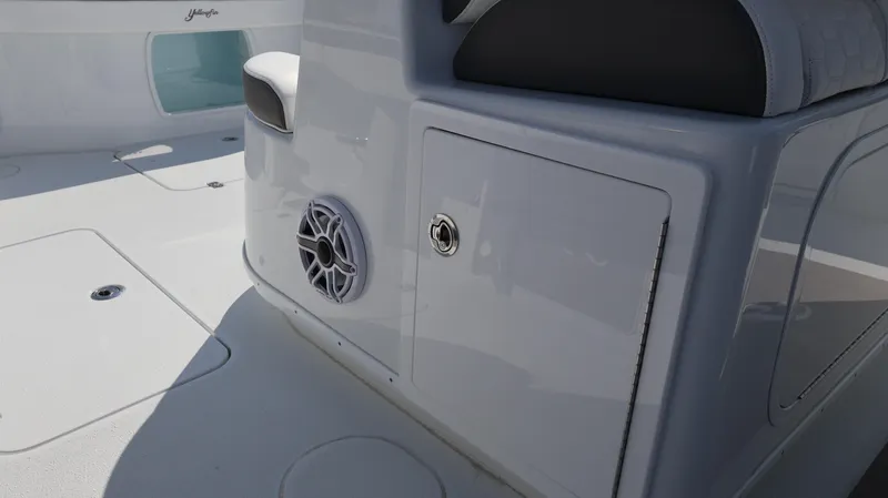 Slide: The Image of 2025 Yellowfin 39 Offshore boat interior with speaker and storage compartment. - 50