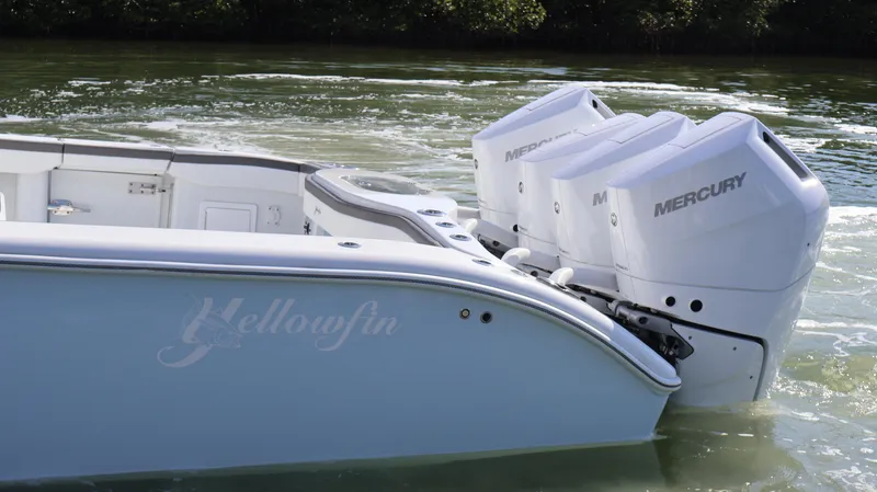 Slide: The Image of 2025 Yellowfin 39 Offshore boat with triple Mercury engines on water. - 9