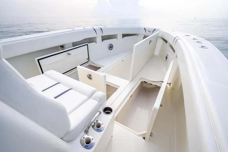Slide: The Image of 2014 SeaVee 34 boat interior with open storage compartments and seating. - 21