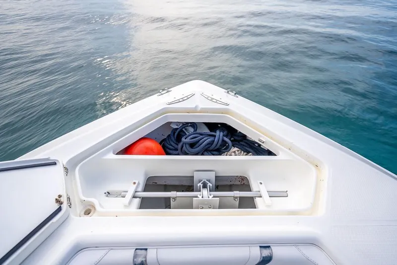 Slide: The Image of Bow storage of 2014 SeaVee 34 boat with ropes and buoy on calm water. - 22