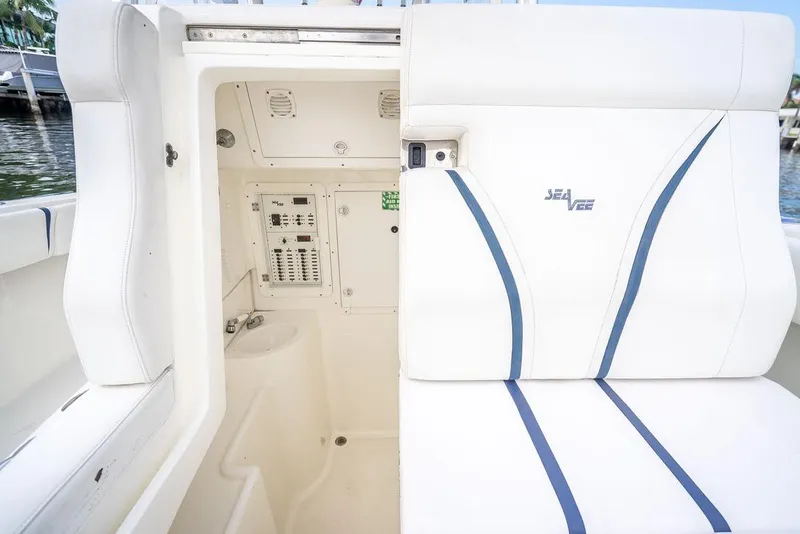 Slide: The Image of 2014 SeaVee 34 boat interior with white seating and control panel. - 26