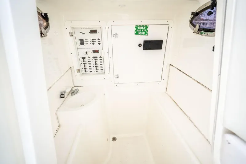 Slide: The Image of 2014 SeaVee 34 interior with control panel and first aid kit. - 27