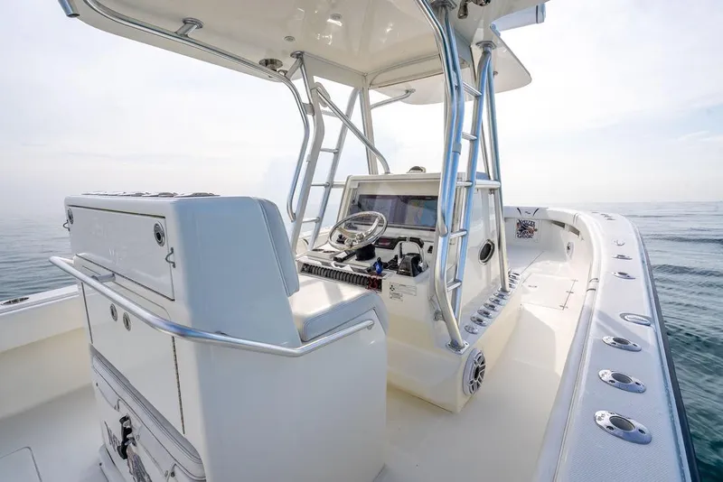 Slide: The Image of 2014 SeaVee 34 boat interior with helm, ocean view, and modern design. - 39