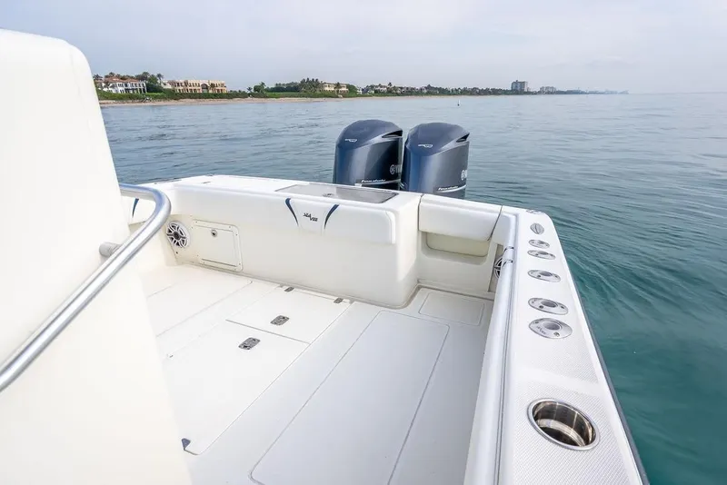Slide: The Image of 2014 SeaVee 34 boat with dual engines on calm water. - 44
