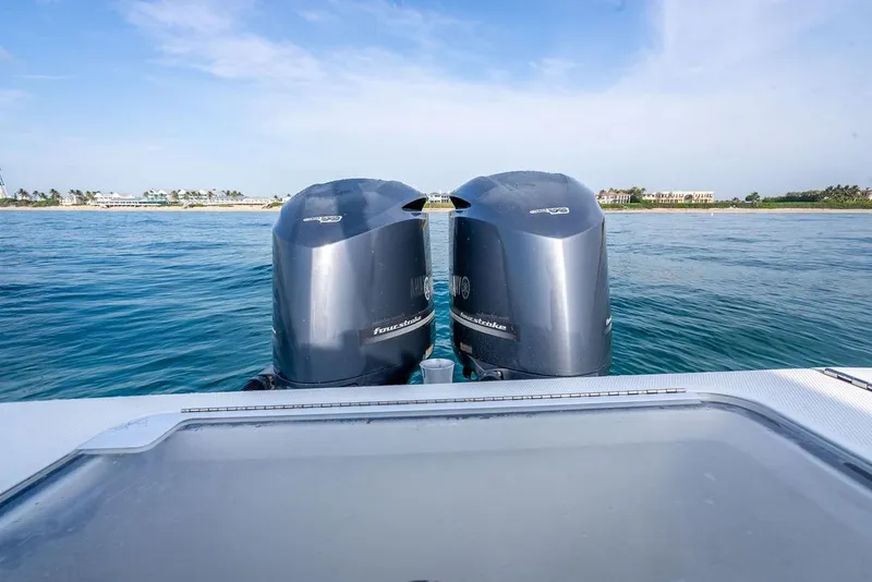 Slide: The Image of 2014 SeaVee 34 boat with twin outboard motors on calm water. - 45