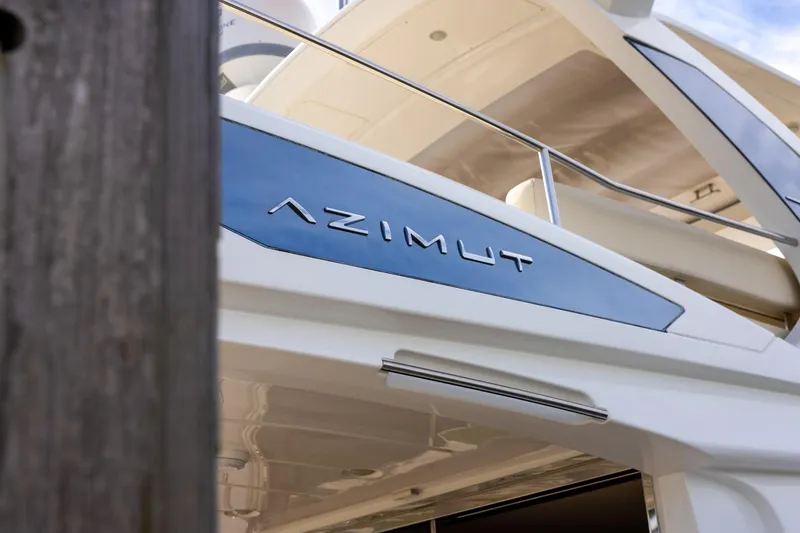 Slide: The Image of Azimut 54 Flybridge 2014 yacht, showcasing sleek design and branding. - 13