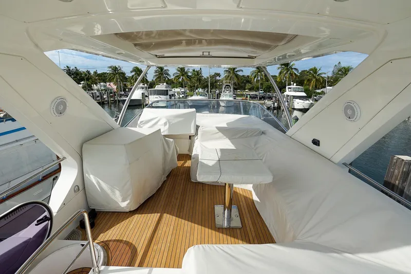 Slide: The Image of Luxurious 2014 Azimut 54 Flybridge yacht with spacious covered seating area. - 25