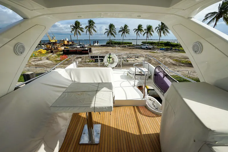 Slide: The Image of Luxurious 2014 Azimut 54 Flybridge yacht interior with ocean view and palm trees. - 27