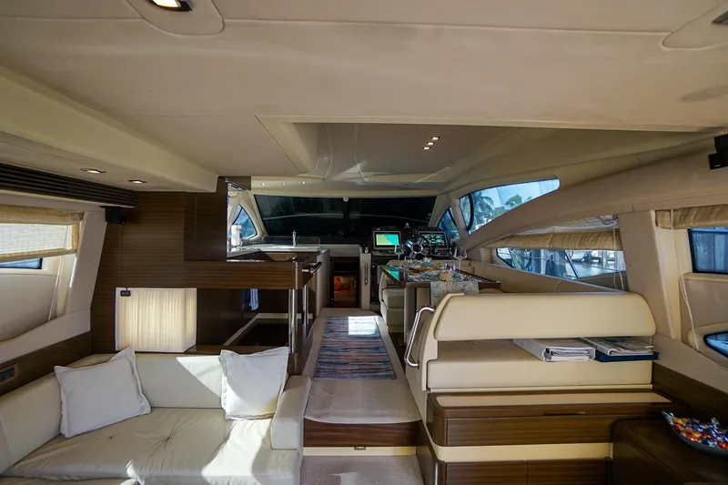 Slide: The Image of Luxurious interior of 2014 Azimut 54 Flybridge yacht with modern furnishings and navigation equipment. - 29