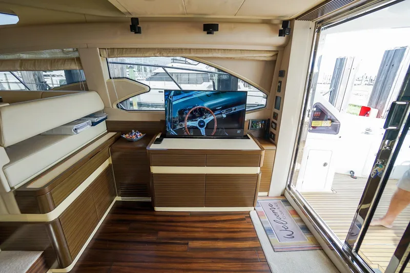 Slide: The Image of Luxurious interior of 2014 Azimut 54 Flybridge yacht with TV and elegant wood finish. - 31