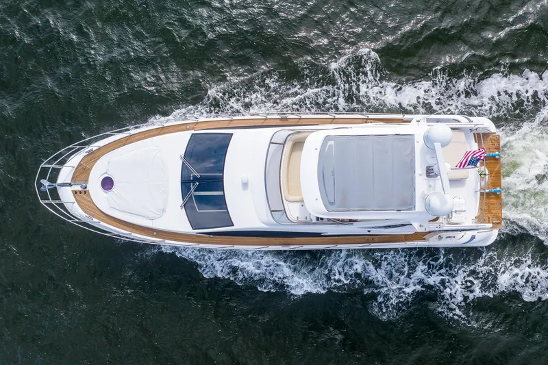 Slide: The Image of Overhead view of 2014 Azimut 54 Flybridge yacht cruising on water. - 4