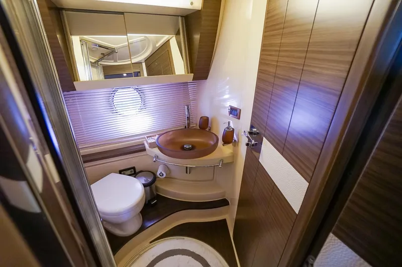 Slide: The Image of Luxurious bathroom in 2014 Azimut 54 Flybridge yacht with modern fixtures and wood accents. - 43