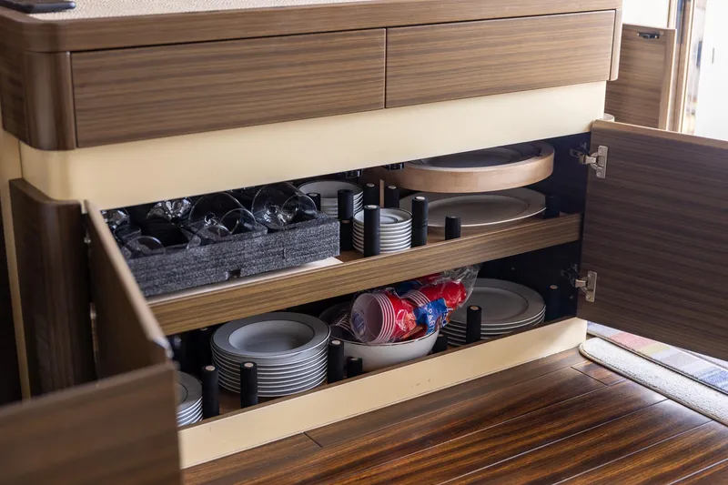 Slide: The Image of Cabinet storage with dishes and glasses on 2014 Azimut 54 Flybridge yacht. - 45