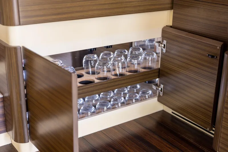 Slide: The Image of Luxurious wooden cabinet with glass storage on 2014 Azimut 54 Flybridge yacht. - 46