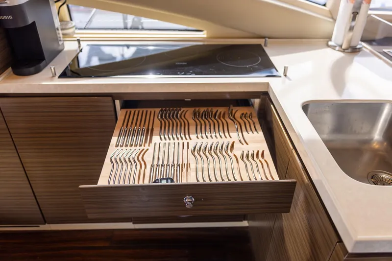 Slide: The Image of Kitchen drawer with organized cutlery in 2014 Azimut 54 Flybridge yacht. - 48