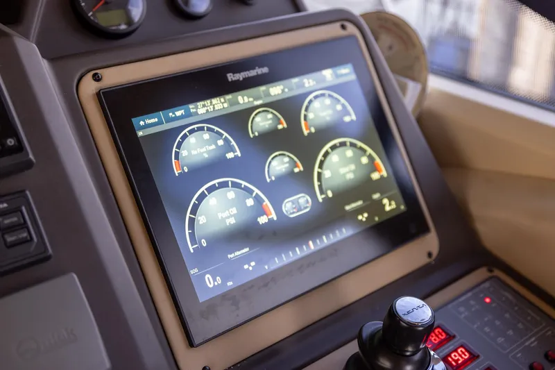 Slide: The Image of Control panel of a 2014 Azimut 54 Flybridge yacht with digital display gauges. - 50