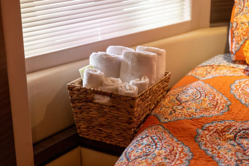 Slide: The Image of Luxurious Azimut 54 Flybridge 2014 interior with basket of towels and vibrant bedding. - 55