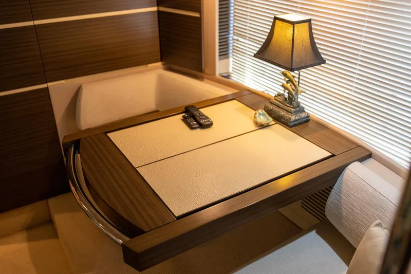 Slide: The Image of Luxurious interior of 2014 Azimut 54 Flybridge yacht with elegant table and lamp. - 56
