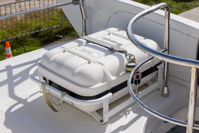 Slide: The Image of Safety equipment on 2014 Azimut 54 Flybridge yacht deck, featuring a secured white container. - 71