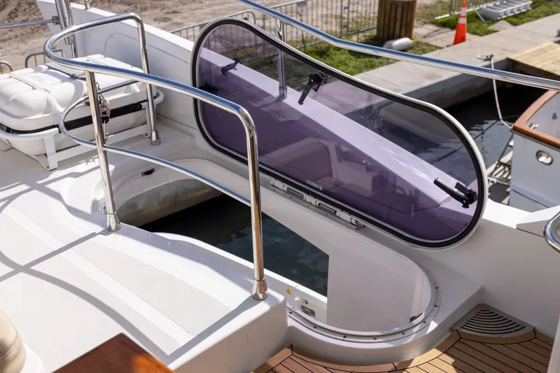 Slide: The Image of Azimut 54 Flybridge 2014 yacht deck with sleek railings and tinted hatch. - 72