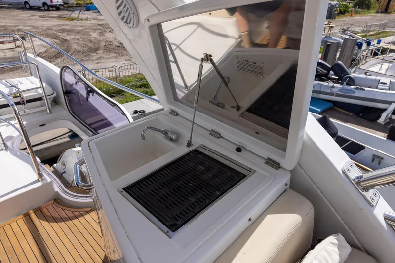 Slide: The Image of Outdoor kitchen on 2014 Azimut 54 Flybridge yacht with sink and grill. - 77