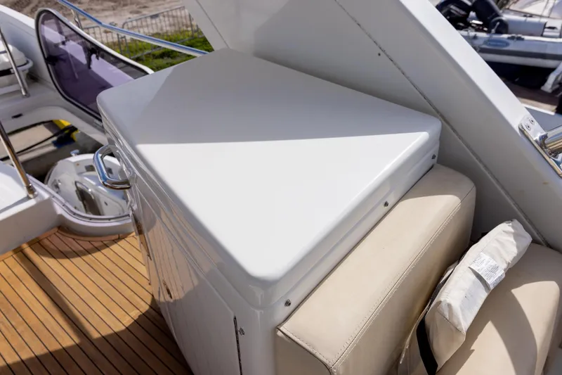 Slide: The Image of 2014 Azimut 54 Flybridge yacht deck with seating and storage. - 80