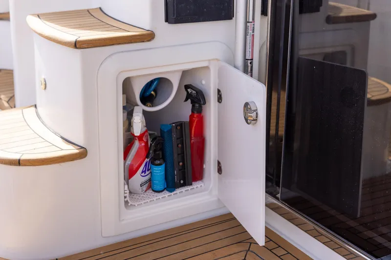 Slide: The Image of Storage compartment on 2014 Azimut 54 Flybridge yacht with cleaning supplies. - 83