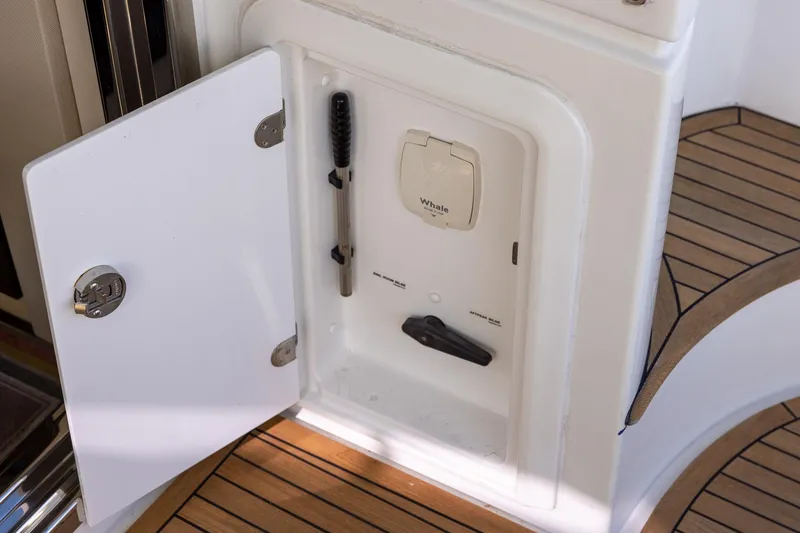 Slide: The Image of Open storage compartment on 2014 Azimut 54 Flybridge yacht with wooden flooring. - 84