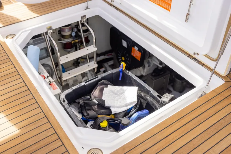 Slide: The Image of Open engine compartment of 2014 Azimut 54 Flybridge yacht with maintenance tools. - 85