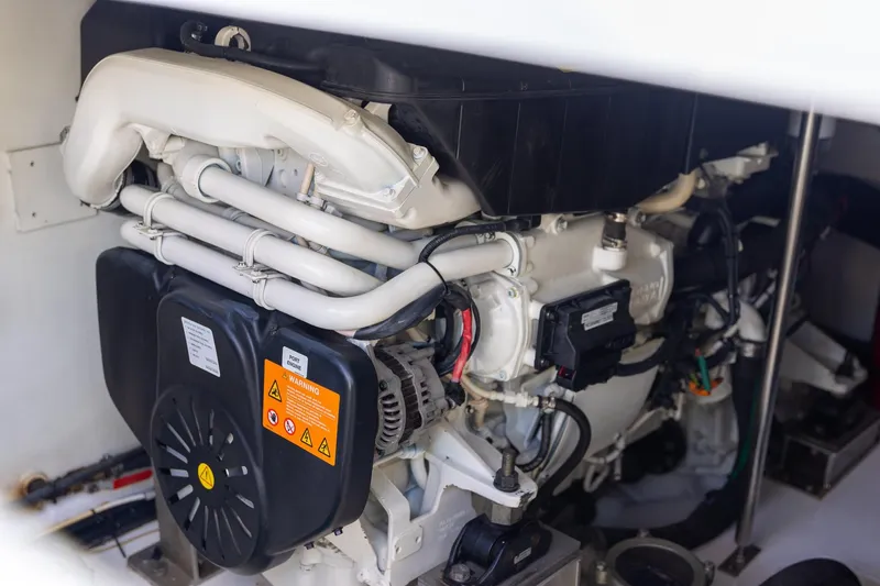 Slide: The Image of Engine compartment of 2014 Azimut 54 Flybridge yacht, showcasing mechanical components. - 86