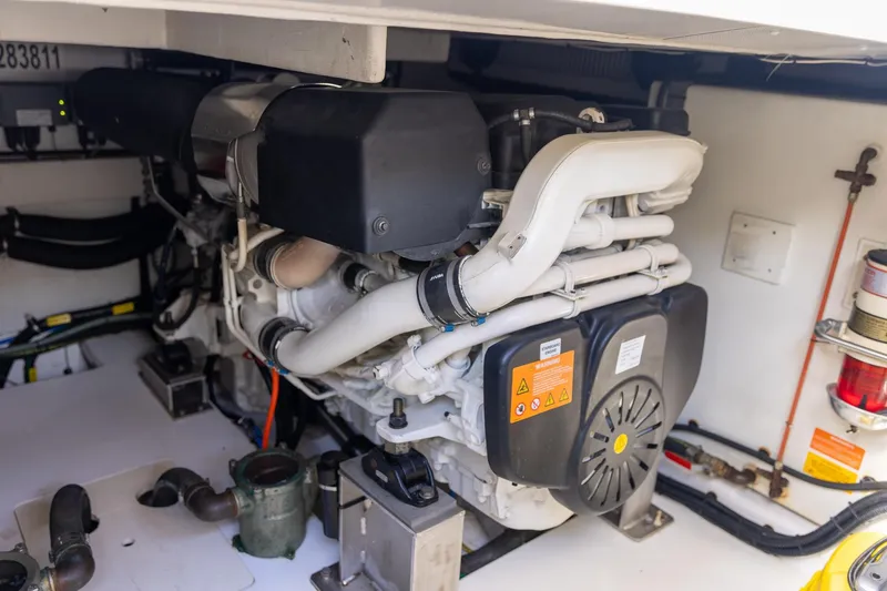 Slide: The Image of Engine room of 2014 Azimut 54 Flybridge yacht, showcasing detailed mechanical components. - 87
