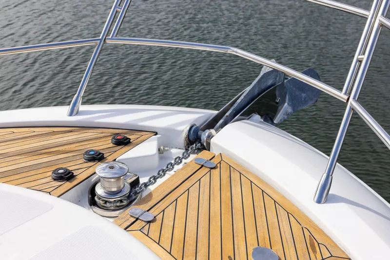 Slide: The Image of Bow of 2014 Azimut 54 Flybridge yacht with anchor and teak deck. - 92
