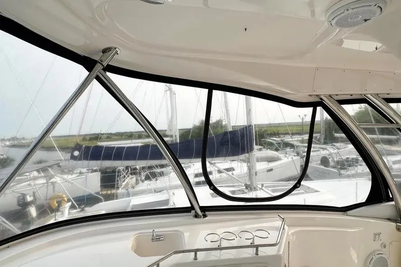 Slide: The Image of Interior view of 2006 Sea Ray 580 Sedan Bridge yacht with marina backdrop. - 19