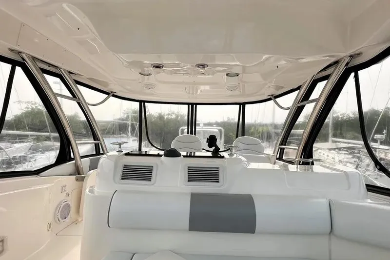 Slide: The Image of Interior view of 2006 Sea Ray 580 Sedan Bridge yacht with panoramic windows. - 23
