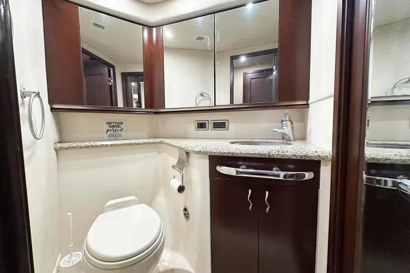 Slide: The Image of Luxurious bathroom in 2006 Sea Ray 580 Sedan Bridge yacht with granite countertop. - 24