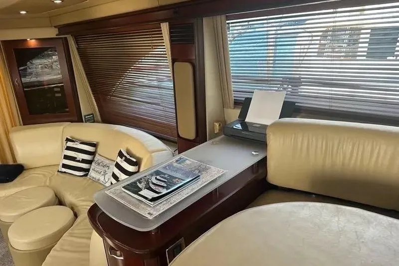 Slide: The Image of Luxurious interior of 2006 Sea Ray 580 Sedan Bridge with leather seating and modern decor. - 27