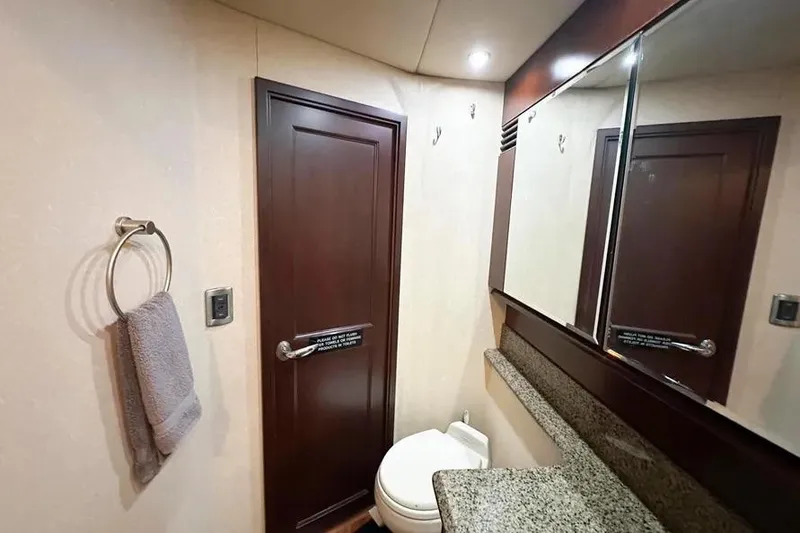 Slide: The Image of Luxurious bathroom in 2006 Sea Ray 580 Sedan Bridge yacht with granite countertop. - 29