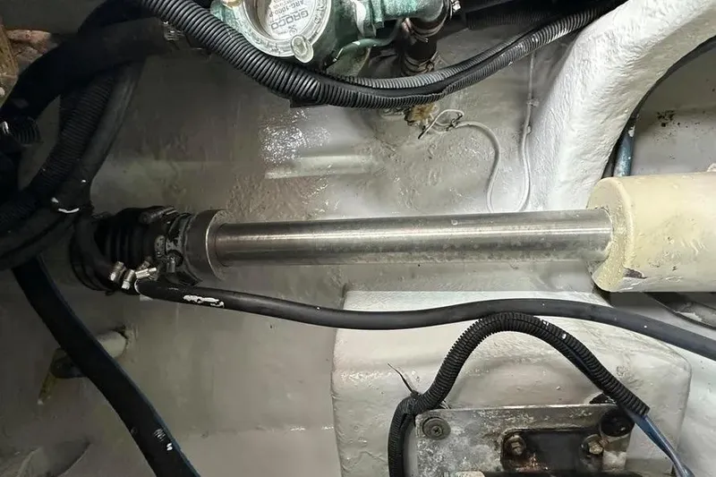 Slide: The Image of Engine compartment of a 2006 Sea Ray 580 Sedan Bridge, showing mechanical components and wiring. - 3