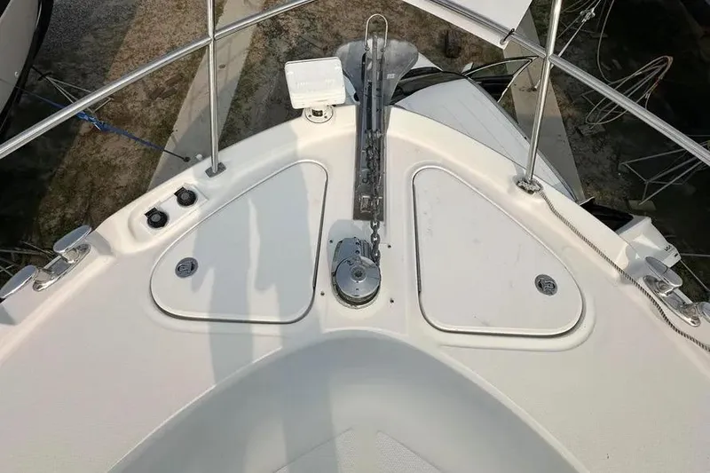 Slide: The Image of Bow of 2006 Sea Ray 580 Sedan Bridge with anchor and storage compartments. - 36