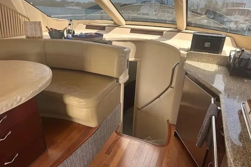 Slide: The Image of Luxurious interior of 2006 Sea Ray 580 Sedan Bridge yacht with leather seating and modern amenities. - 45